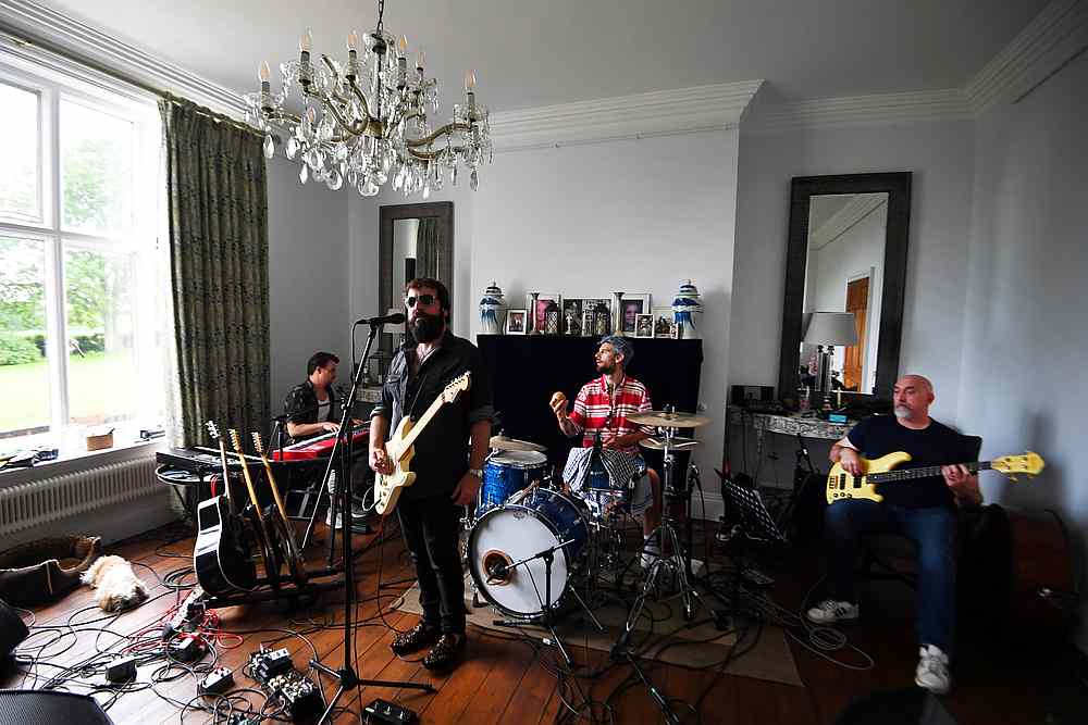 British rock band The Sharpville Show jam in their makeshift studio as they isolate together with their families and pets in a rented luxury estate in Sheringham, Britain May 20, 2020. u00e2u20acu201d Reuters pic