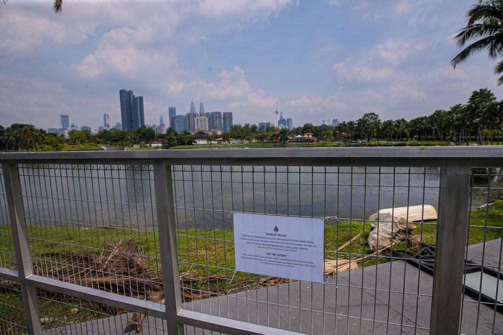 A notice of closure is pictured at the entrance of Taman Tasik Titiwangsa in Kuala Lumpur May 28, 2020. u00e2u20acu201d Picture by Hari Anggara