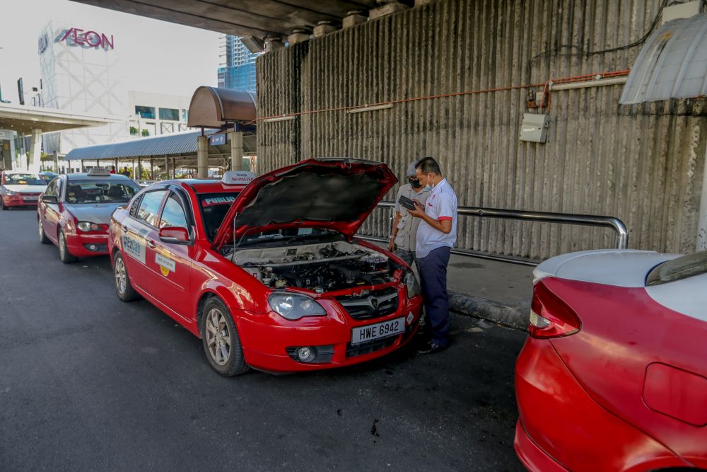 Taxi drivers are pictured at the Taman Maluri LRT station May 4, 2020. u00e2u20acu201d Picture by Firdaus Latif