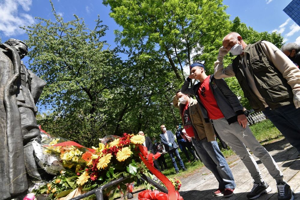 Activists shows old partisan salute after laying flowers as about 30 people, including delegation of anti-fascists and regional politicians gather for a brief ceremony around the statue of Josip Broz Tito in Sarajevo, on May 4, 2020. u00e2u20acu201d AFP pic