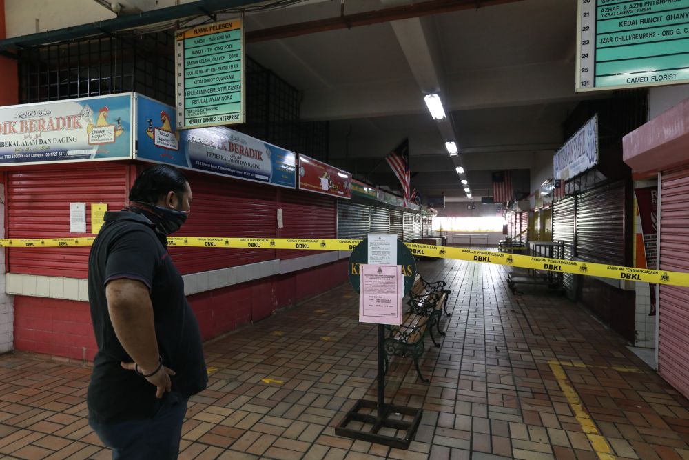 The Taman Tun Dr Ismail wet market is cordoned off from the public on May 19, 2020. u00e2u20acu201d Picture by Ahmad Zamzahuri