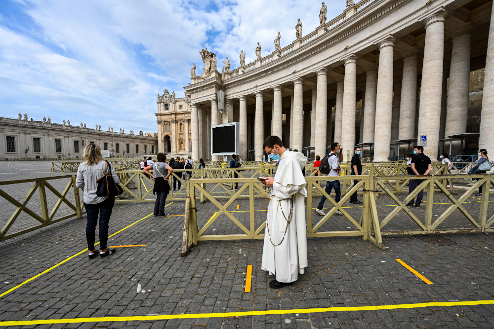 People line up in respect of security distancing to access St Peteru00e2u20acu2122s Basilica May 18, 2020 in The Vatican during the lockdown aimed at curbing the spread of the Covid-19 infection, caused by the novel coronavirus. u00e2u20acu201d AFP pic 