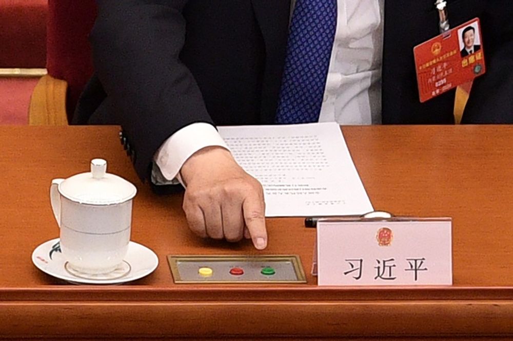 Chinese President Xi Jinping votes on a proposal to draft a security law on Hong Kong during the closing session of the National Peopleu00e2u20acu2122s Congress at the Great Hall of the People in Beijing, May 28, 2020. u00e2u20acu201d AFP pic