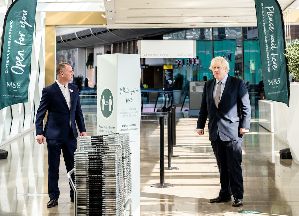 Prime Minister Boris Johnson visits the M&S clothing department and other retail outlets in Westfield Stratford to see the Covid-19 measure taken before reopening, in London, Britain June 14, 2020. u00e2u20acu201d Julian Simmonds/Pool handout via Reuters