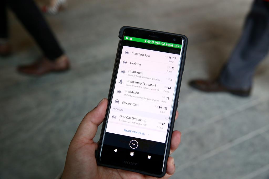 Grab was tricked into believing that 1,758 of the fraudulent ride bookings were genuine and paid out S$26,115 to Ryan Wong Wei Zhi and Chua Wei Beng. u00e2u20acu201d TODAY pic