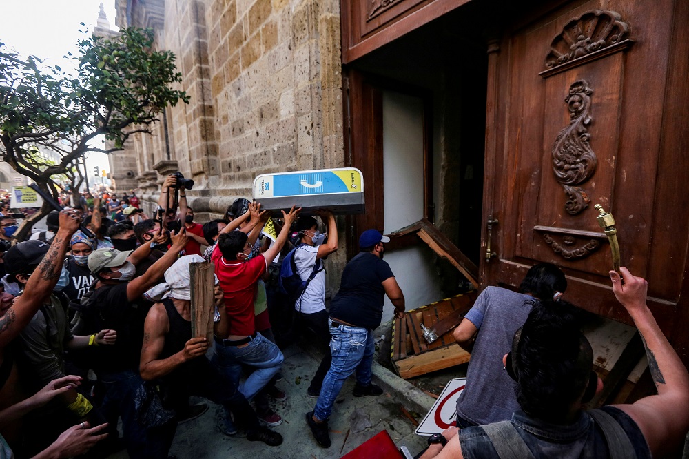 Demonstrators smash down a door of the Jalisco State Government Palace during a protest to demand justice for Giovanni Lopez during the coronavirus disease outbreak in Guadalajara, Mexico June 4, 2020. u00e2u20acu201d Reuters pic