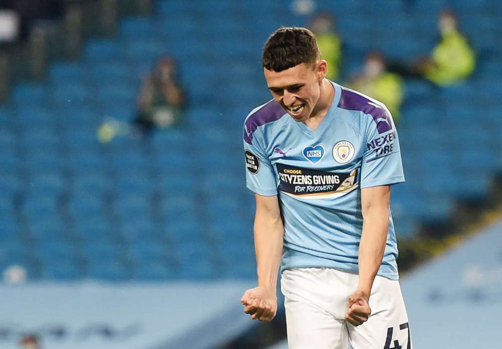 Manchester Cityu00e2u20acu2122s Phil Foden celebrates scoring their third goal as play resumes behind closed doors following the Covid-19 outbreak, at the Etihad Stadium in Manchester June 17, 2020. u00e2u20acu201d Reuters pic