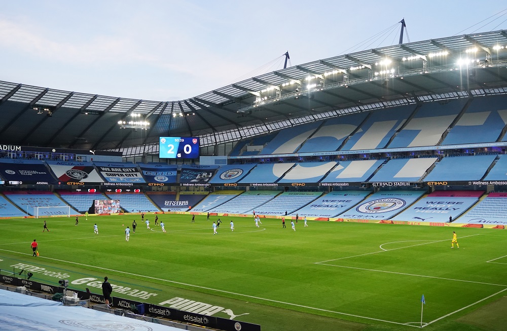 General view of match action as the big screen displays the score as play resumes behind closed doors following the Covid-19 outbreak, at the Etihad Stadium in Manchester June 17, 2020. u00e2u20acu201d Reuters pic