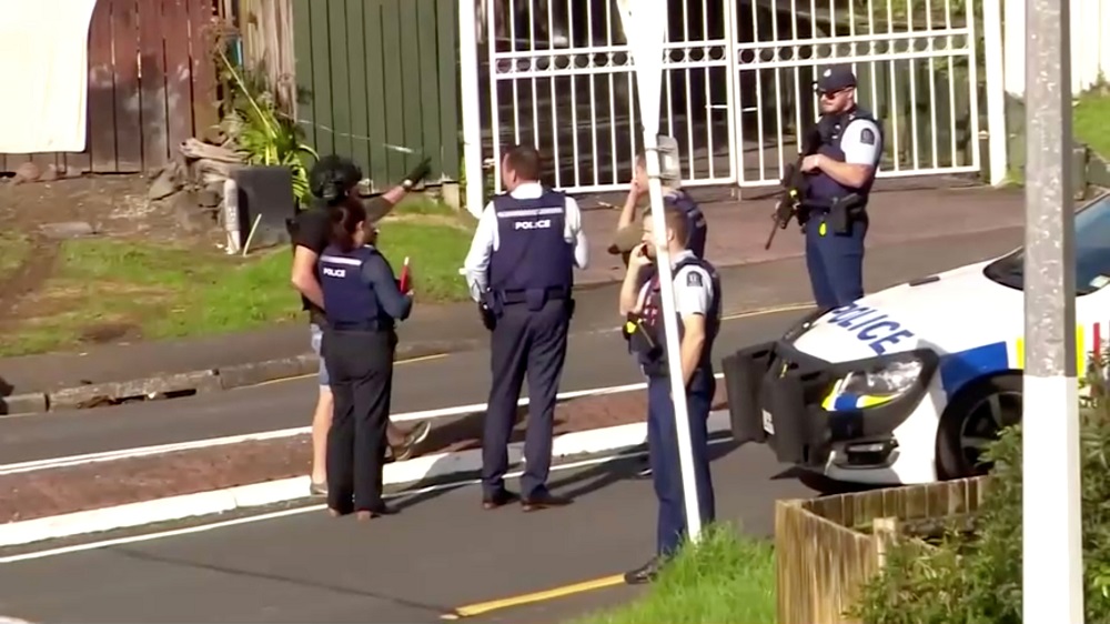 Police officers work at the scene after two officers were shot during a routine traffic stop in Auckland June 19, 2020. u00e2u20acu201d Picture by TVNZ via Reuters  