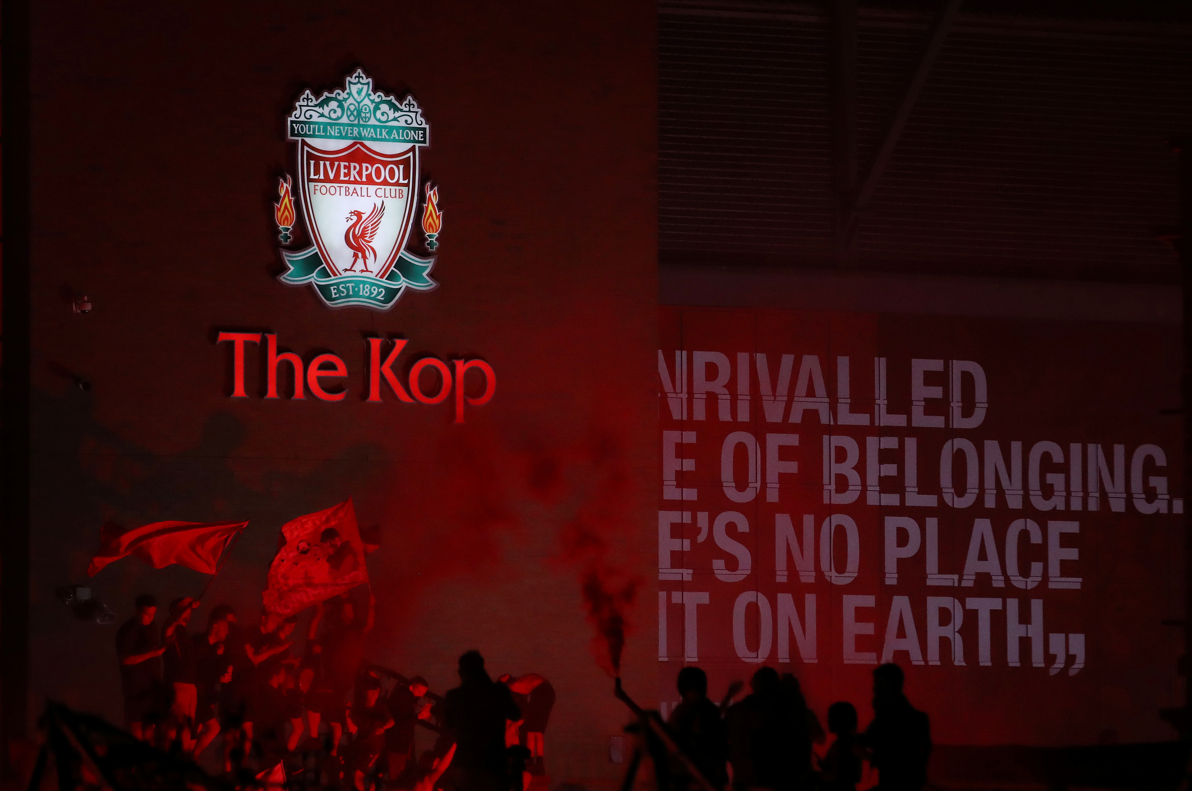 Liverpool fans celebrate winning the Premier League outside Anfield in Liverpool June 25, 2020. u00e2u20acu201d Action Images via Reuters/Carl Recine