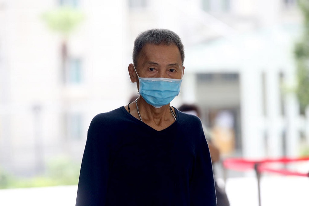 Lee Ah Loo walking out of the State Courts on May 22, 2020. He pleaded guilty on June 10, 2020 to hurling vulgarities at enforcement officers from the National Environment Agency while at Beo Crescent Market. u00e2u20acu201d TODAY pic