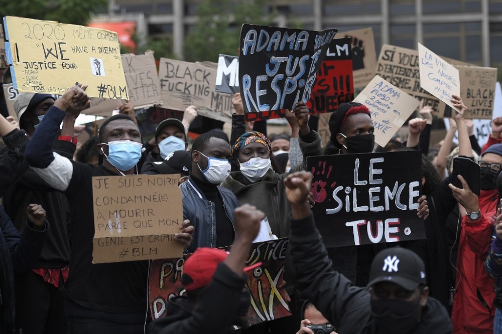 Demonstrators, some wearing a protective face mask, hold placards reading u00e2u20acu02dcSilence killsu00e2u20acu2122 during a protest in Strasbourg June 5, 2020. u00e2u20acu201d AFP pic