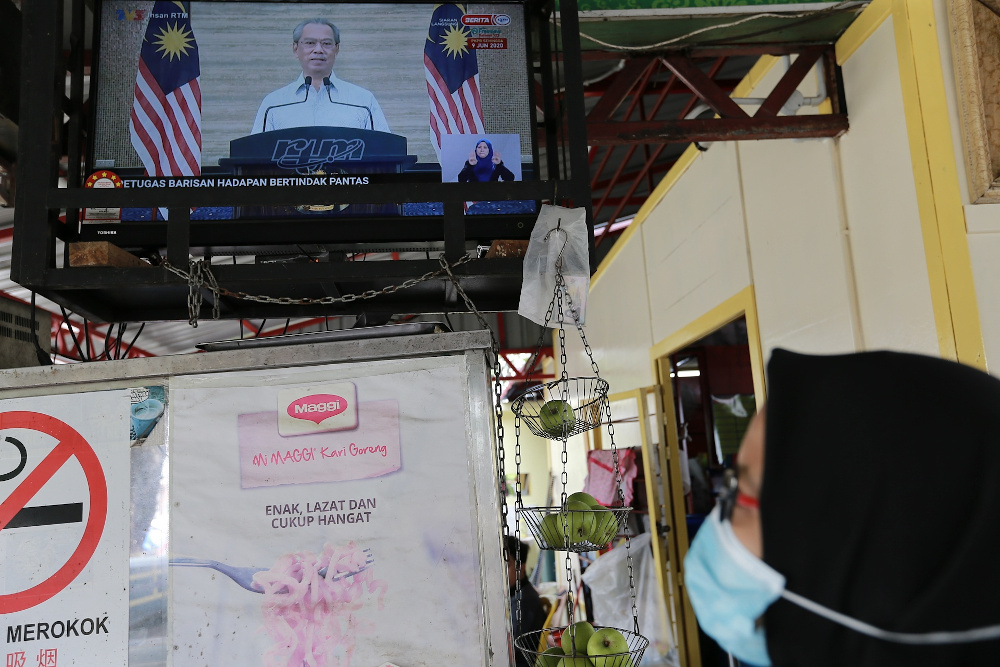 A live broadcast of Prime Minister Tan Sri Muhyiddin Yassin on the recovery movement control order is seen on a television in Kuala Lumpur June 7, 2020. u00e2u20acu2022 Picture by Ahmad Zamzahuri