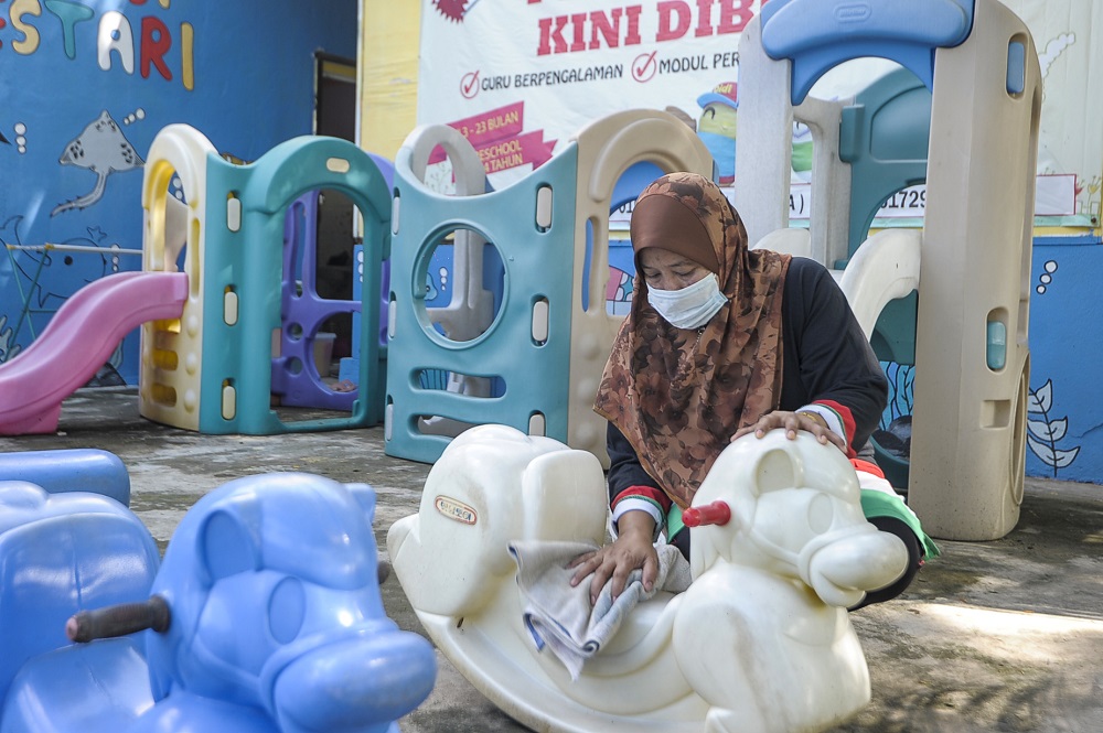 A staff member is seen disinfecting the playground area of a childcare centre in Kajang June 9, 2020 u00e2u20acu201d Picture by Shafwan Zaidon