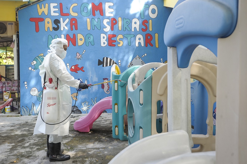 A staff member is seen disinfecting the playground area of a childcare centre in Kajang June 9, 2020 u00e2u20acu201d Picture by Shafwan Zaidon
