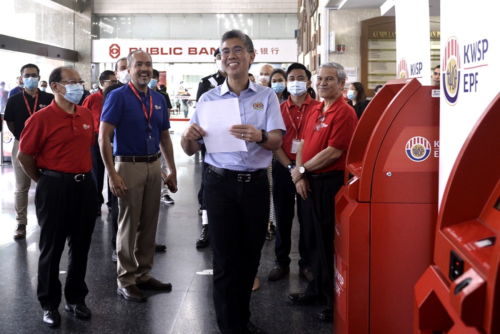 Finance Minister Tengku Datuk Seri Zafrul Abdul Aziz (centre) during a visit to the Employees Provident Fundu00e2u20acu2122s headquarters in Kuala Lumpur June 12, 2020. u00e2u20acu201d Picture by Miera Zulyana