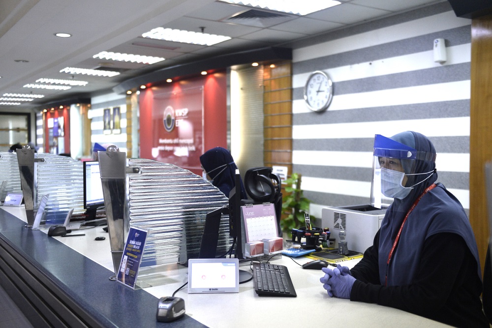 File picture shows staff members working at the Employees Provident Fund’s headquarters in Kuala Lumpur June 12, 2020. — Picture by Miera Zulyana