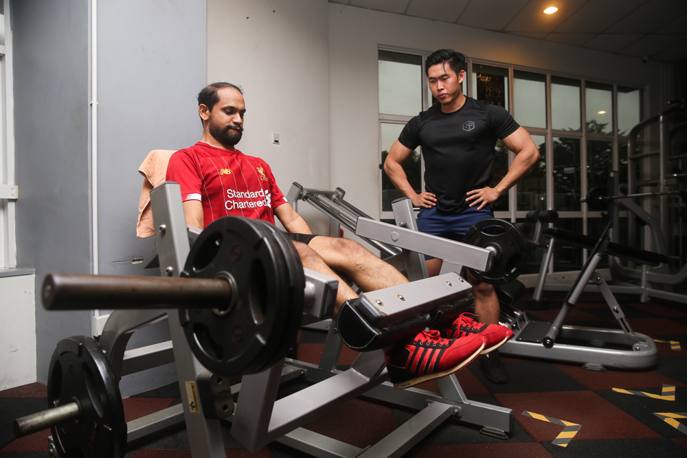 Gym goers work out while observing social distancing at Real Fitness in Puchong June 15, 2020. — Picture by Choo Choy May