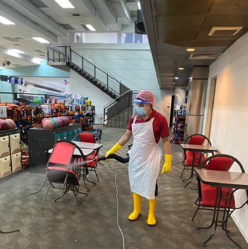 An employee disinfects the premises of Sunway Mega Lanes in preparation for reopening of the bowling centre in Subang Jaya. u00e2u20acu201d Picture courtesy of Sunway Mega Lanes