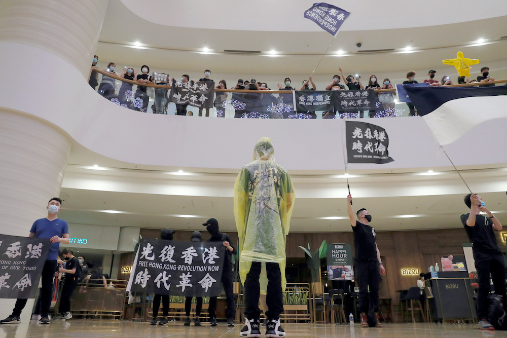 Pro-democracy demonstrators raise their phones with flashlights during a vigil for a protester Marco Leung Ling-kit who fell to his death during a demonstration outside the Pacific Place mall a year ago, in Hong Kong June 15, 2020. u00e2u20acu201d Reuters pic
