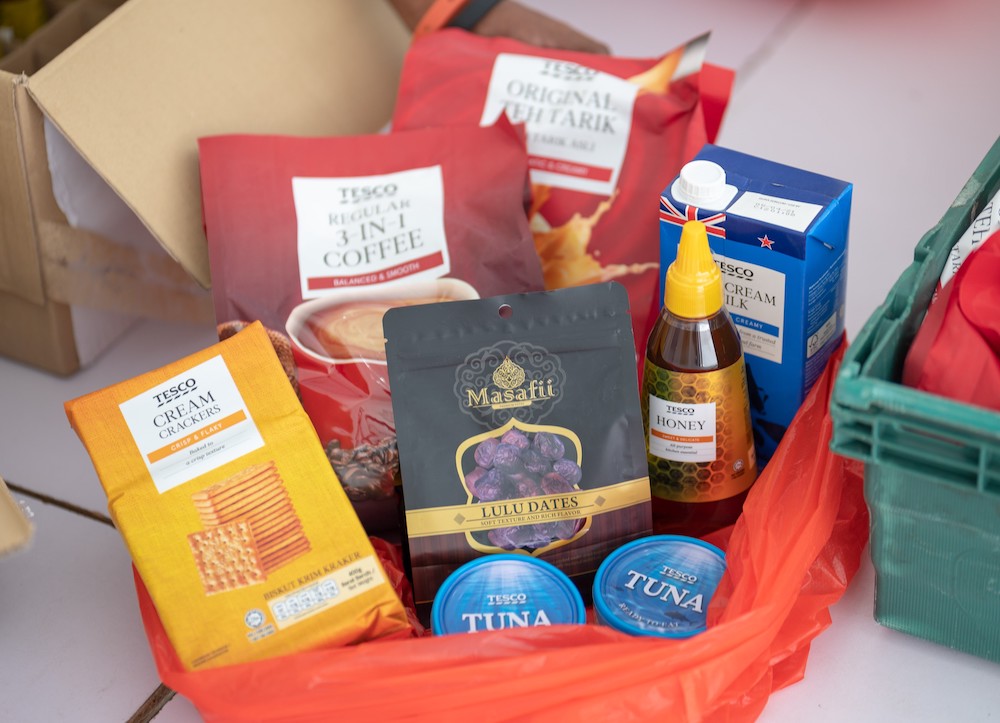 The food parcels are filled with common household essential food supplies. — Picture courtesy of Tesco Malaysia. 