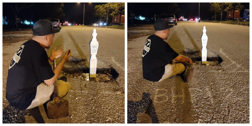 A Klang Man who is a member of Ikatan Silaturrahim Brotherhood had placed a tombstone in a pothole in Klang as a gritty symbol of lives who are at risk due to the pothole.u00e2u20acu201d Photo courtesy of Facebook/ Brotherhood Shah Alam