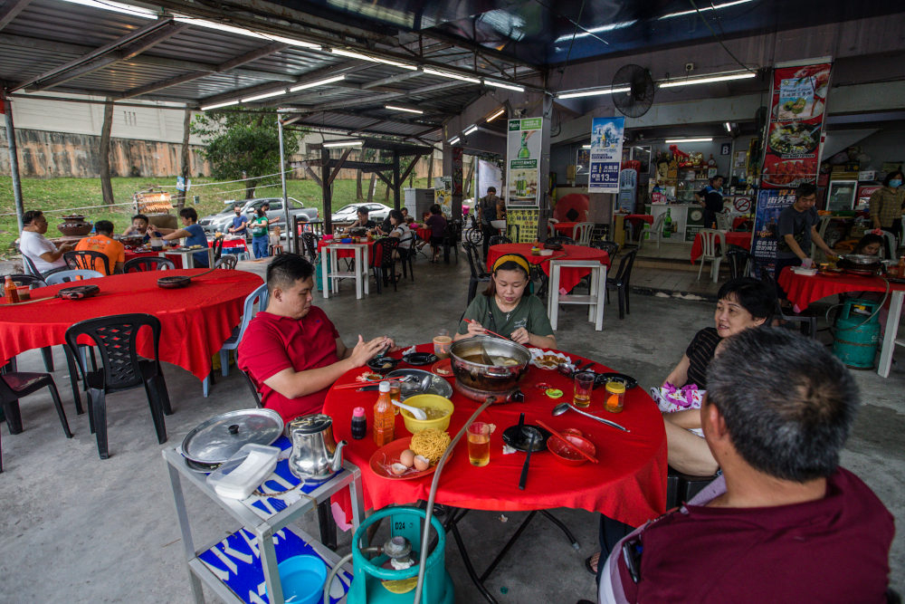 Patrons are seen dining at the Tai Tao Steamboat restaurant in Menjalara, Kepong June 20, 2020. — Picture by Firdaus Latif