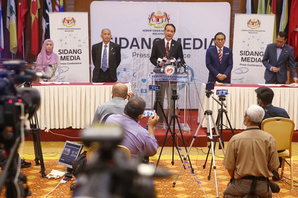Health director-general Datuk Dr Noor Hisham Abdullah (centre) speaks at a press conference in Putrajaya June 24, 2020. u00e2u20acu201d Picture by Choo Choy May