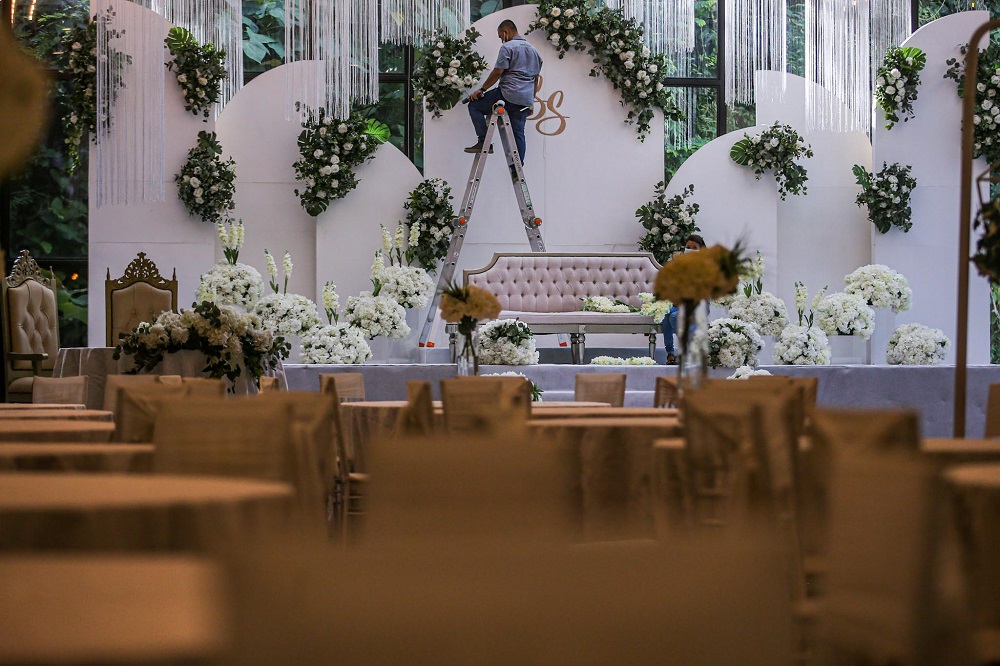 Staff members are seen setting up decorations at the Forest Valley wedding hall in Bandar Mahkota Cheras June 25, 2020. u00e2u20acu201d Picture by Hari Anggara