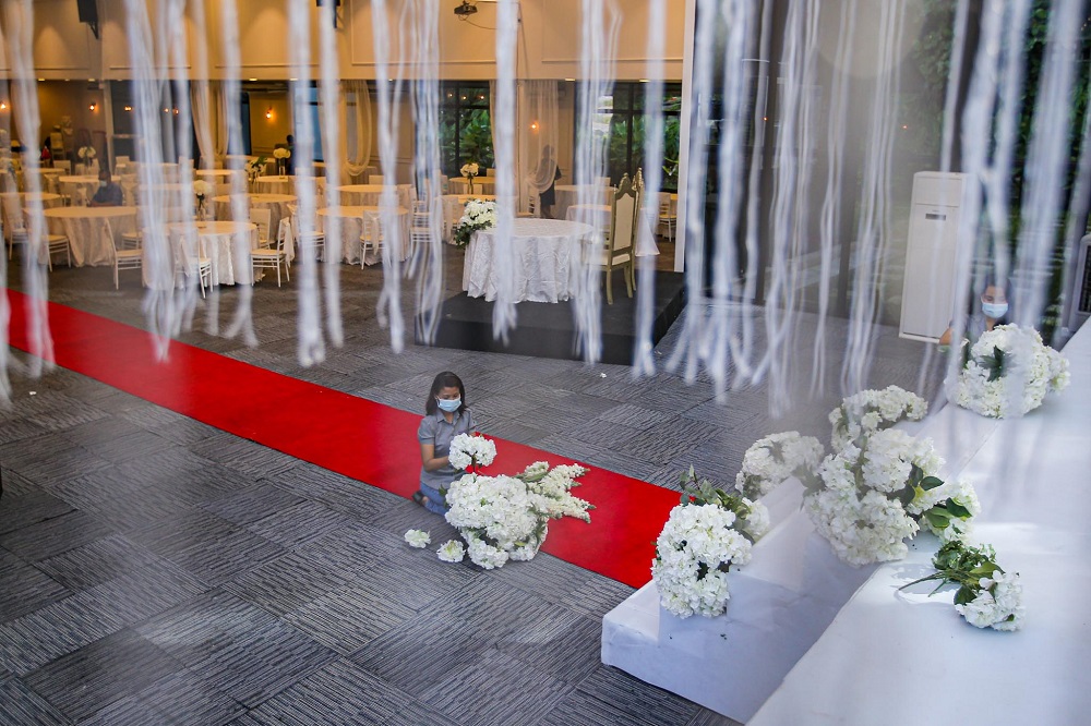 Staff members are seen decorating the Forest Valley wedding hall in Bandar Mahkota Cheras June 25, 2020. u00e2u20acu201d Picture by Hari Anggara