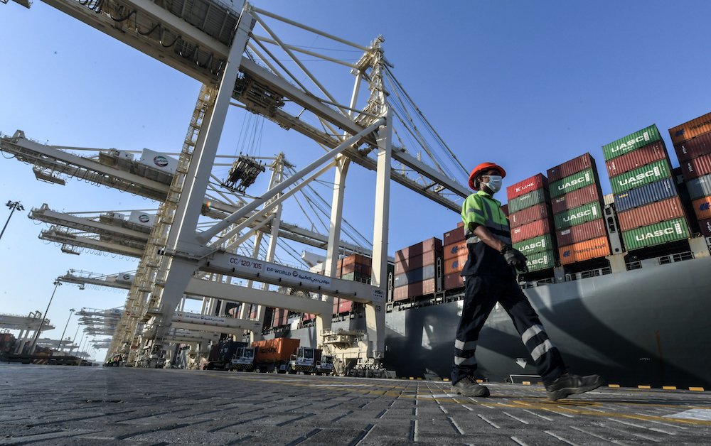 An employee wearing a face mask against the coronavirus, is pictured at the port of Jebel Ali, operated by the Dubai-based giant ports operator DP World, in the southern outskirts of the Gulf emirate of Dubai June 18, 2020. u00e2u20acu201d AFP pic