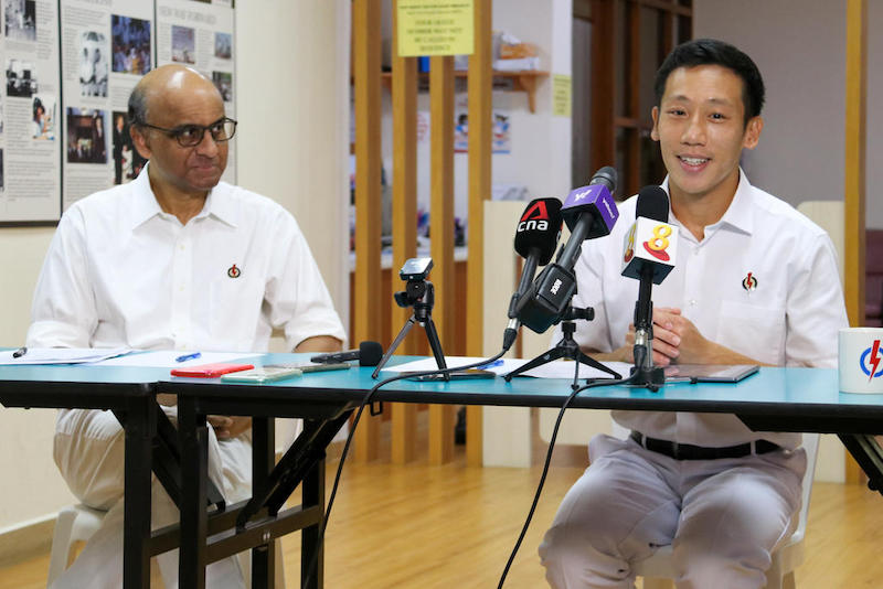 Tharman Shanmugaratnam (left) and Xie Yao Quan speak to the media at PAP's Bukit Batok East Branch Office, June 29, 2020. u00e2u20acu201d TODAY pic