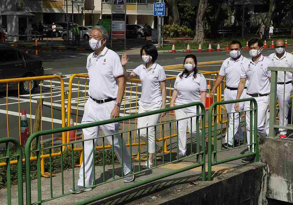 PAPu00e2u20acu2122s teams from Pasir Ris-Punggol GRC and Sengkang West SMC arrive at St Anthonyu00e2u20acu2122s Canossian Primary School in Bedok North, Singapore June 30, 2020. u00e2u20acu201d TODAY pic