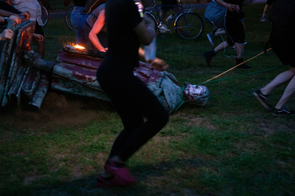 Protesters drag a statue of Christopher Columbus to a nearby pond after pulling it down in Richmond, Virginia, June 9, 2020. u00e2u20acu201d AFP pic