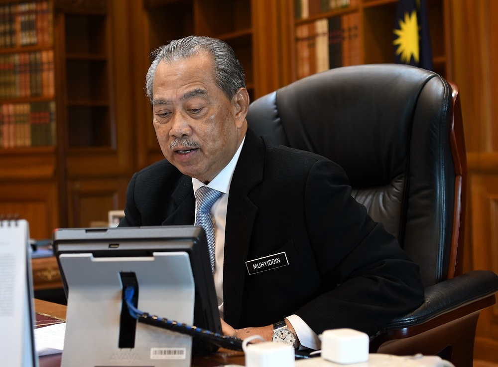 Prime Minister Tan Sri Muhyiddin Yassin receiving a phone call from Vietnam Prime Minister Nguyen Xuan Phuc in his office in Putrajaya June 23, 2020. u00e2u20acu201d Bernama pic