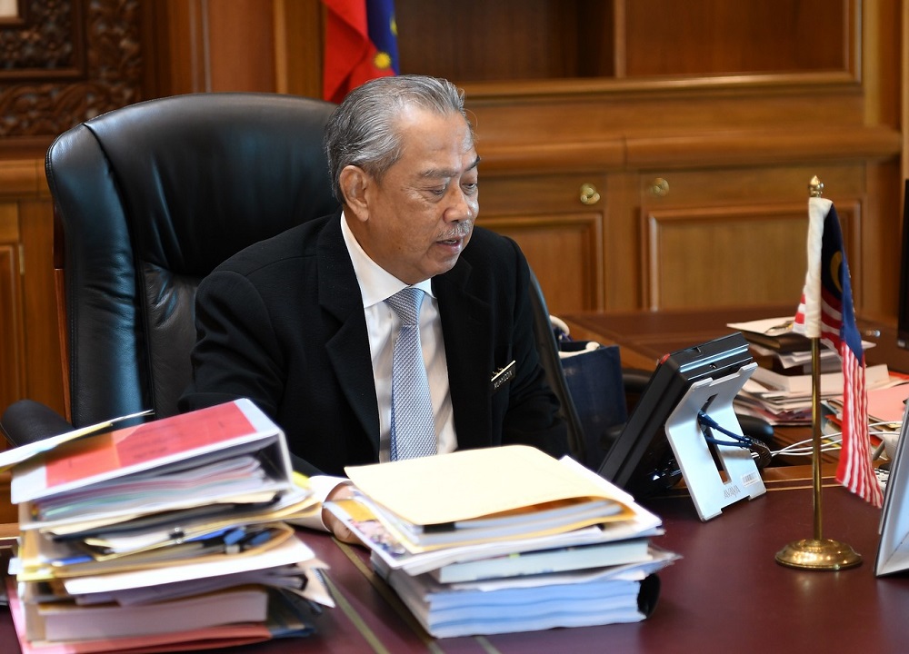 Prime Minister Tan Sri Muhyiddin Yassin receiving a phone call from Vietnam Prime Minister Nguyen Xuan Phuc in his office in Putrajaya June 23, 2020. u00e2u20acu201d Bernama pic