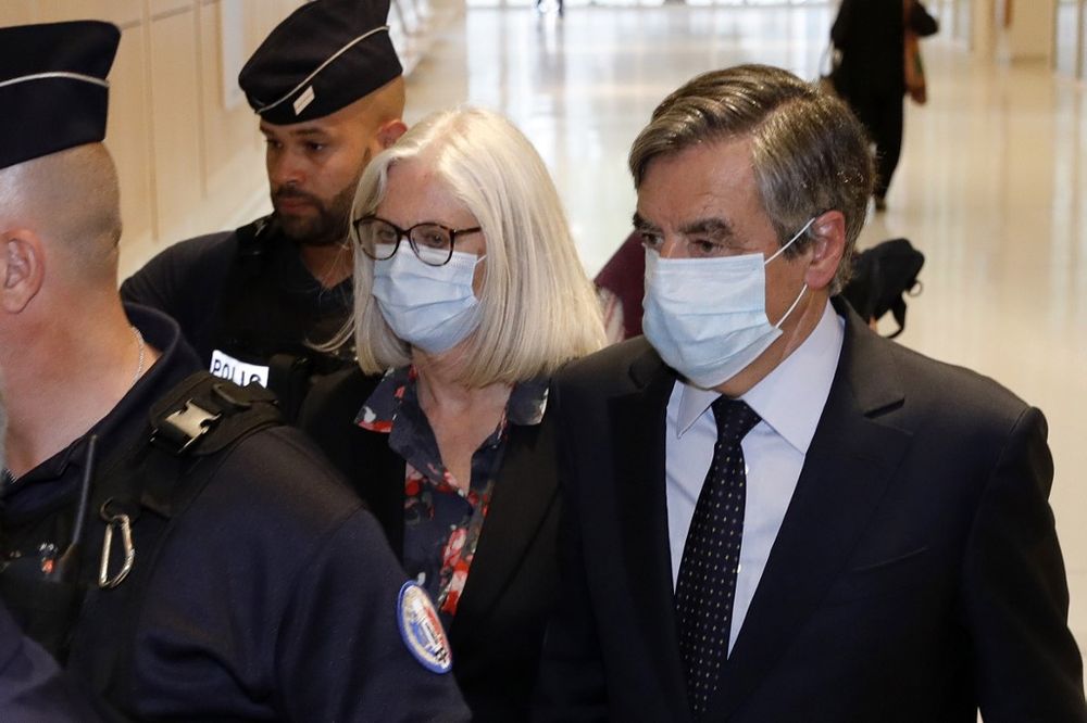 Former French Prime minister Francois Fillon (right) and his wife Penelope Fillon arrive at the Parisu00e2u20acu2122 courthouse on June 29, 2020 for the ruling on a trial for embezzlement in the context of an alleged job fraud. u00e2u20acu201d AFP pic