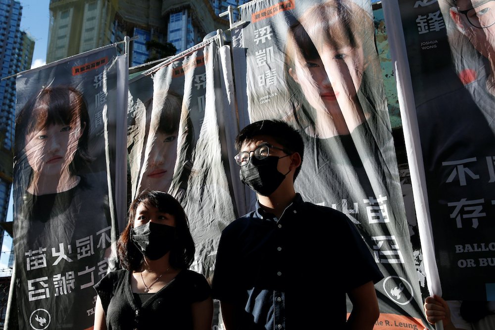 Pro-democracy activist Joshua Wong announces his plans to run for legislature next to pro-democracy district councillor Jannelle Leung, in Hong Kong, China June 19, 2020. u00e2u20acu2022 Reuters  picnn
