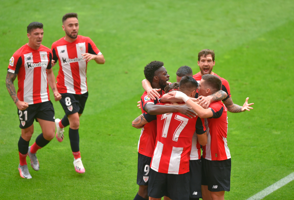Athletic Bilbaou00e2u20acu2122s players celebrate after teammate Spanish forward Iker Muniain scored during the Spanish League football match between Athletic Club Bilbao and Club Atletico de Madrid at the San Mames stadium in Bilbao June 14, 2020. u00e2u20acu201d AFP pic 