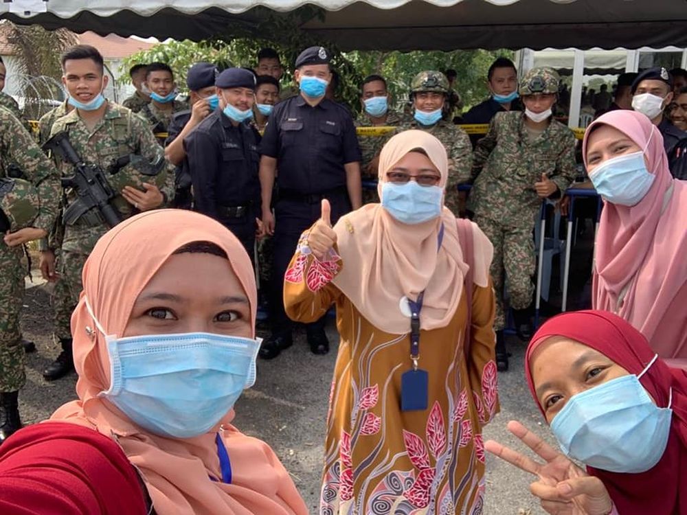 The frontline workers, from various walks of life, were visibly happy to finally be done with their work in the town. — Picture via Facebook/Combi Pkd Kuala Langat
