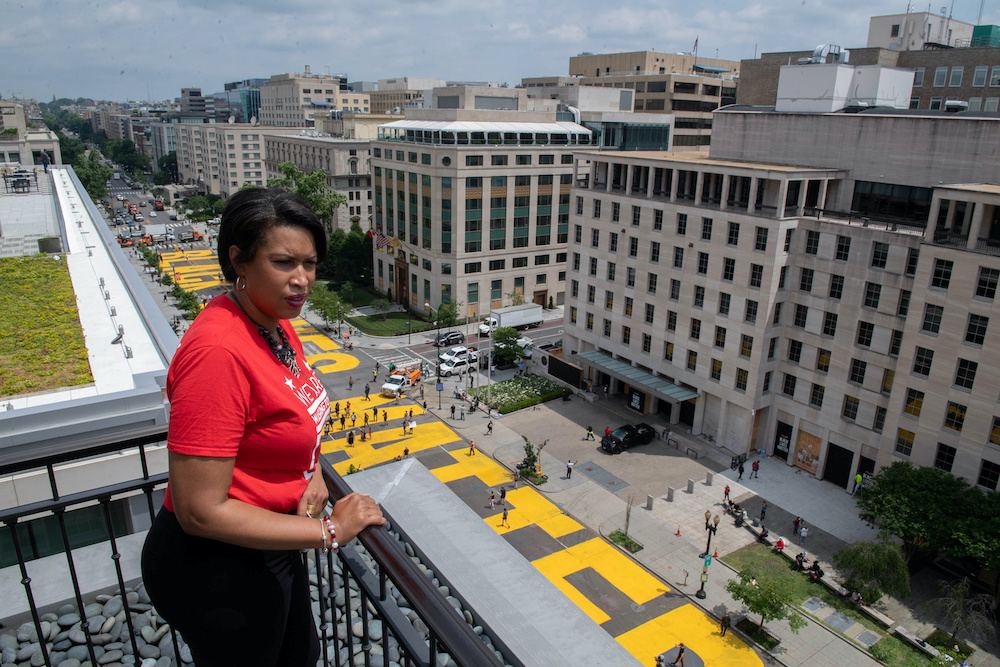 Mayor Muriel Bowser looks out over a Black Lives Matter sign that was painted on a street, during nationwide protests against the death in Minneapolis police custody of George Floyd, in Washington, DC, US June 5, 2020 in this handout photo. u00e2u20acu201d Reuters pi