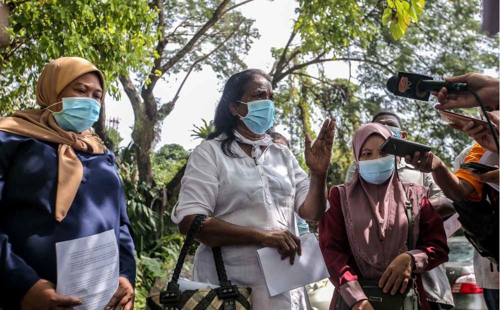National Union of Workers in Hospital Support and Allied Services executive secretary M. Sarasvathy speaks to the press in front of the Ipoh police district headquarters June 22, 2020. u00e2u20acu201d Picture by Farhan Najib