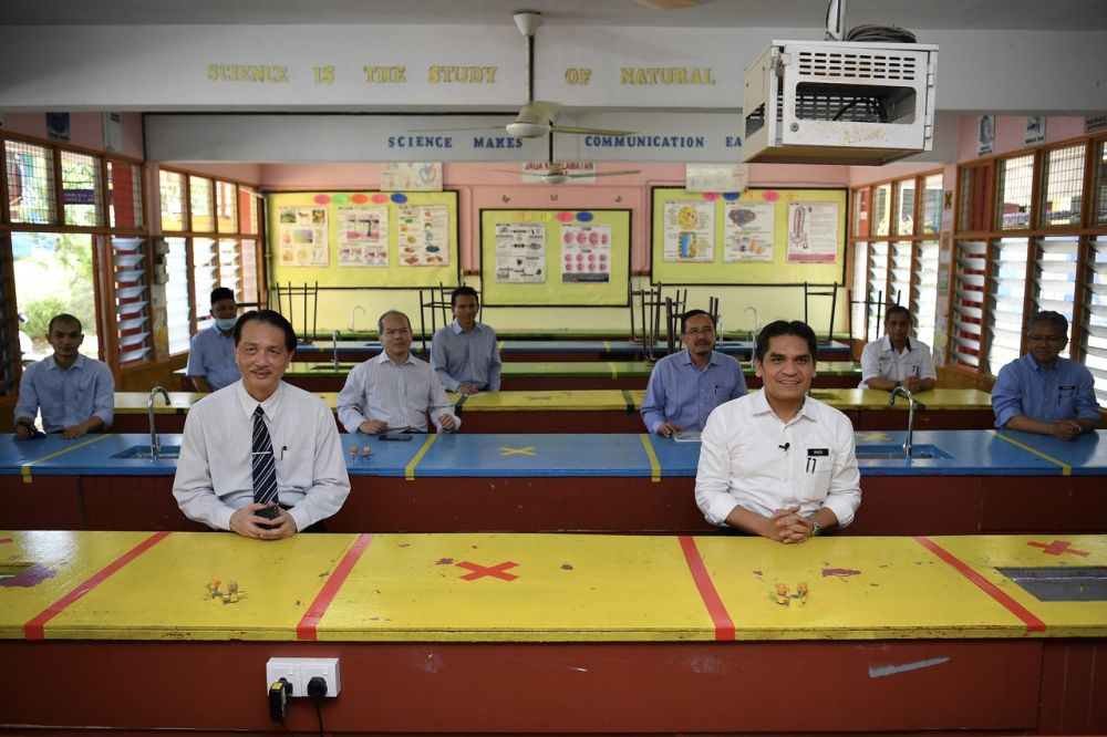 Education Minister Mohd Radzi Md Jidin (right) and Health director-general Datuk Dr Noor Hisham Abdullah during a visit to Sekolah Menengah Kebangsaan Engku Husain in Kajang June 3, 2020. u00e2u20acu201d Bernama picnn