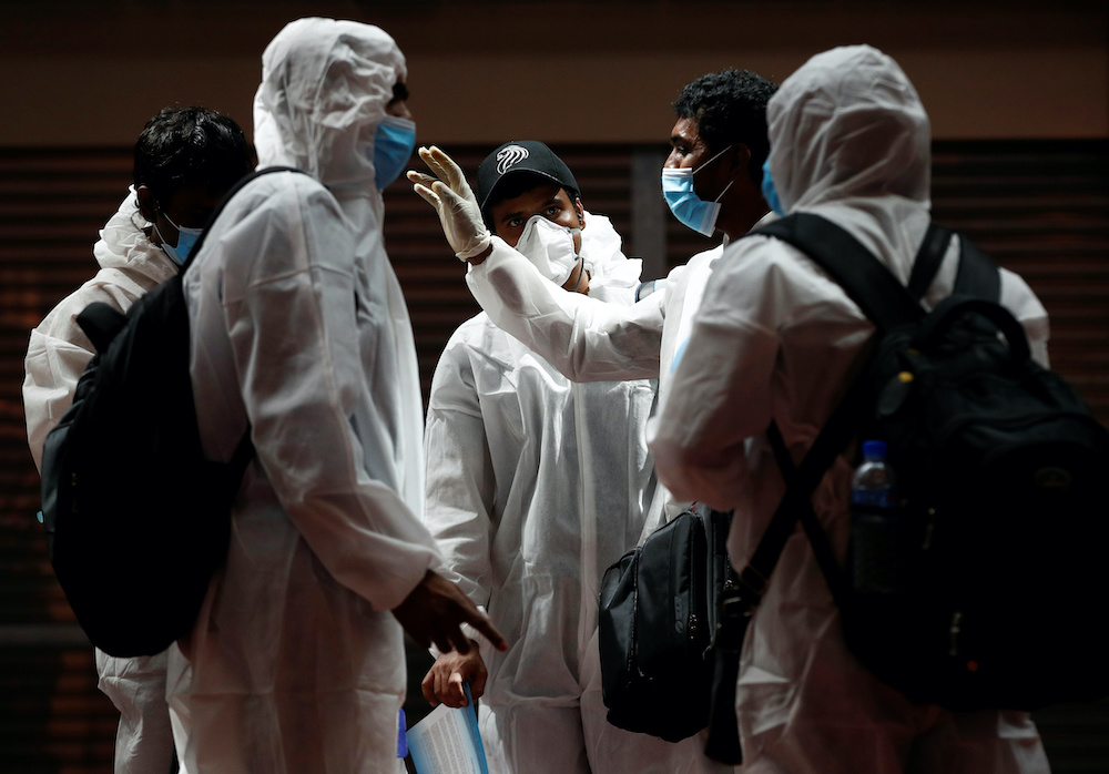 Seafarers who have spent the past months working onboard vessels arrive at the Changi Airport to board their flight back home to India during a crew change amid the coronavirus disease outbreak in Singapore June 12, 2020. u00e2u20acu201d Reuters pic