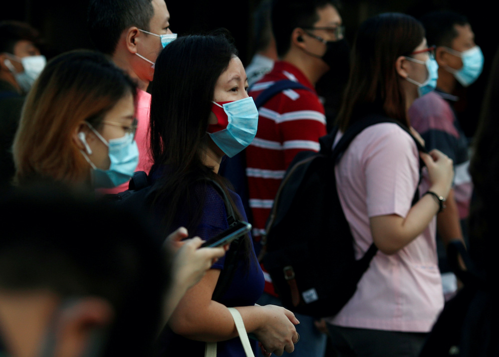 People cross a street during morning peak hour commute amid the coronavirus disease outbreak in Singapore June 3, 2020. u00e2u20acu201d Reuters pic