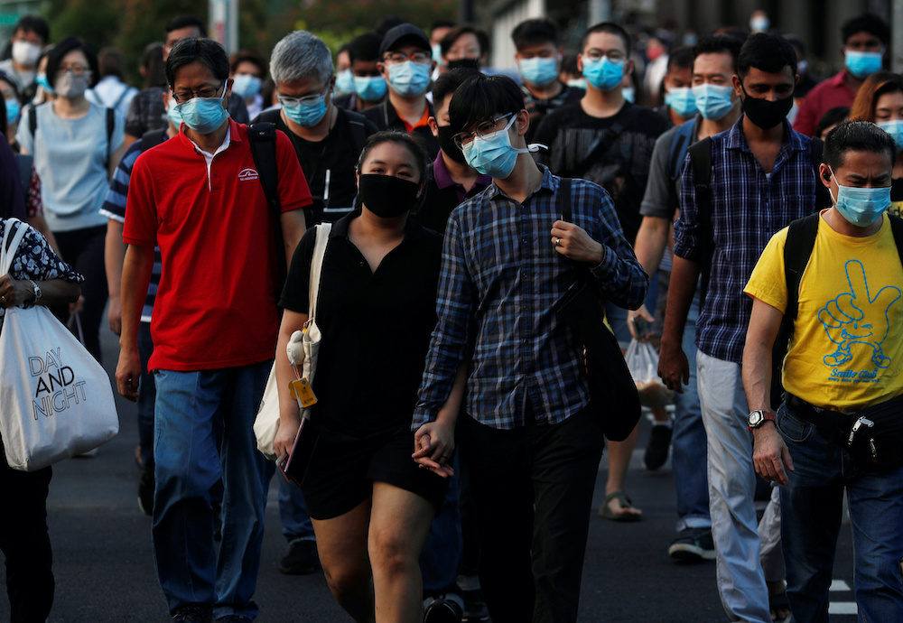 People cross a street during morning peak hour commute amid the coronavirus disease outbreak in Singapore June 3, 2020. u00e2u20acu201d Reuters pic