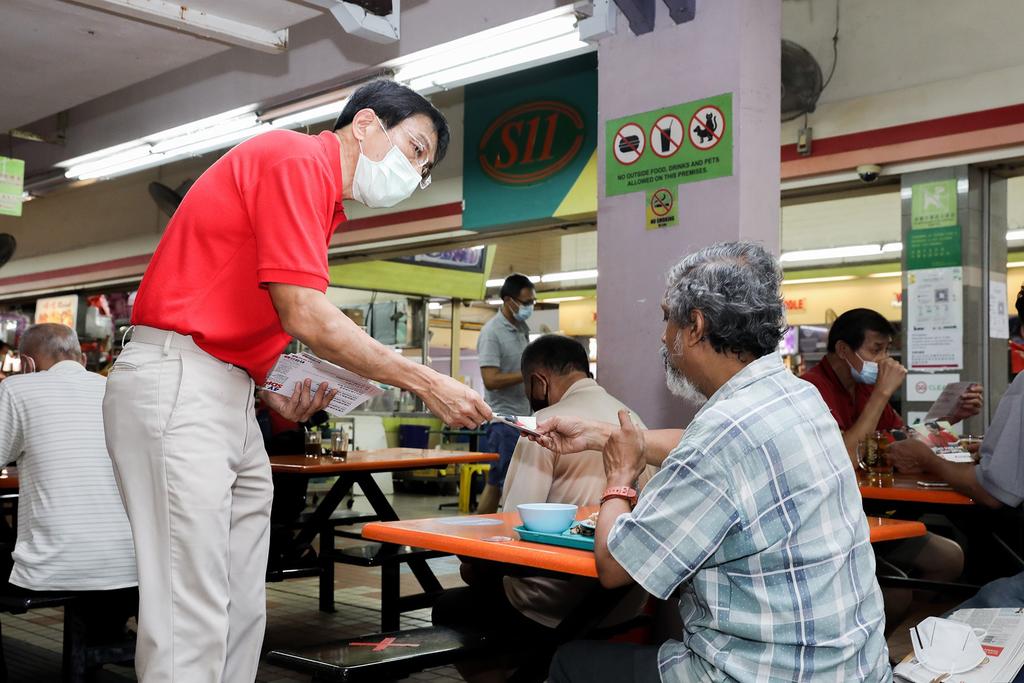 Dr Chee Soon Juan, secretary-general of the Singapore Democratic Party distributing flyers during a walkabout at Bukit Batok on Friday, June 26, 2020. u00e2u20acu2022 TODAY pic