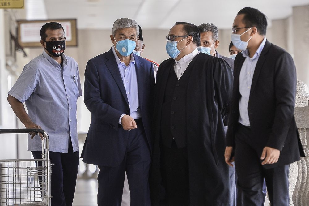 Datuk Seri Ahmad Zahid Hamidi (second from left) is pictured at the Kuala Lumpur High Court June 16, 2020. — Picture by Miera Zulyana