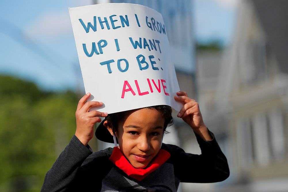 Adam Neves, 6, holds a sign during a rally following the death in Minneapolis police custody of George Floyd, in Boston, Massachusetts June 1, 2020. u00e2u20acu201d Reuters pic