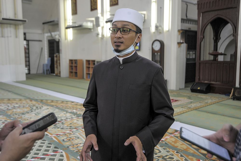 At-Taqwa Mosque imam Ahmad Saufi Mustaffa speaks to reporters after Friday prayers in Kuala Lumpur June 12, 2020.